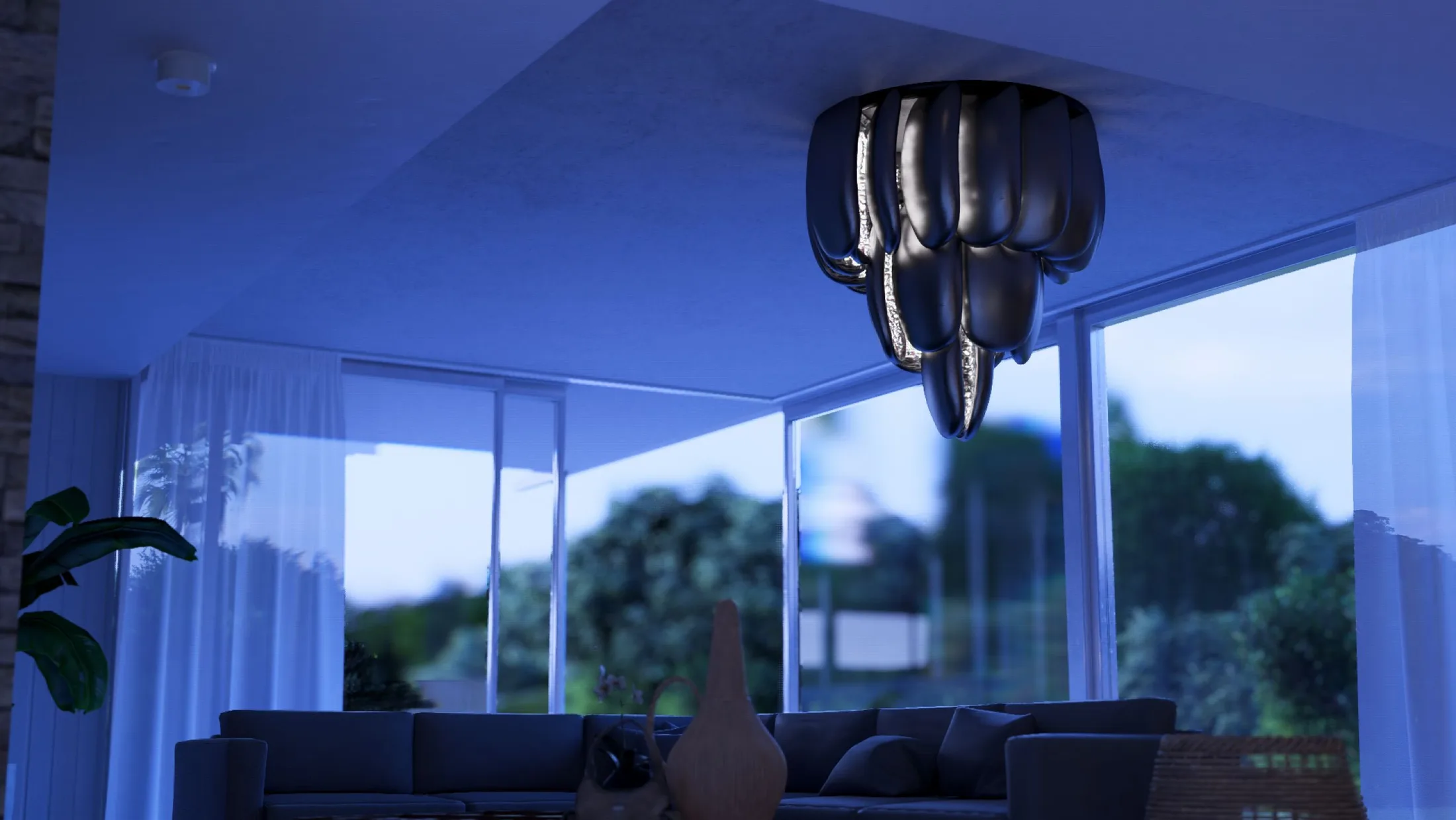 Chandelier over living room seating at dusk